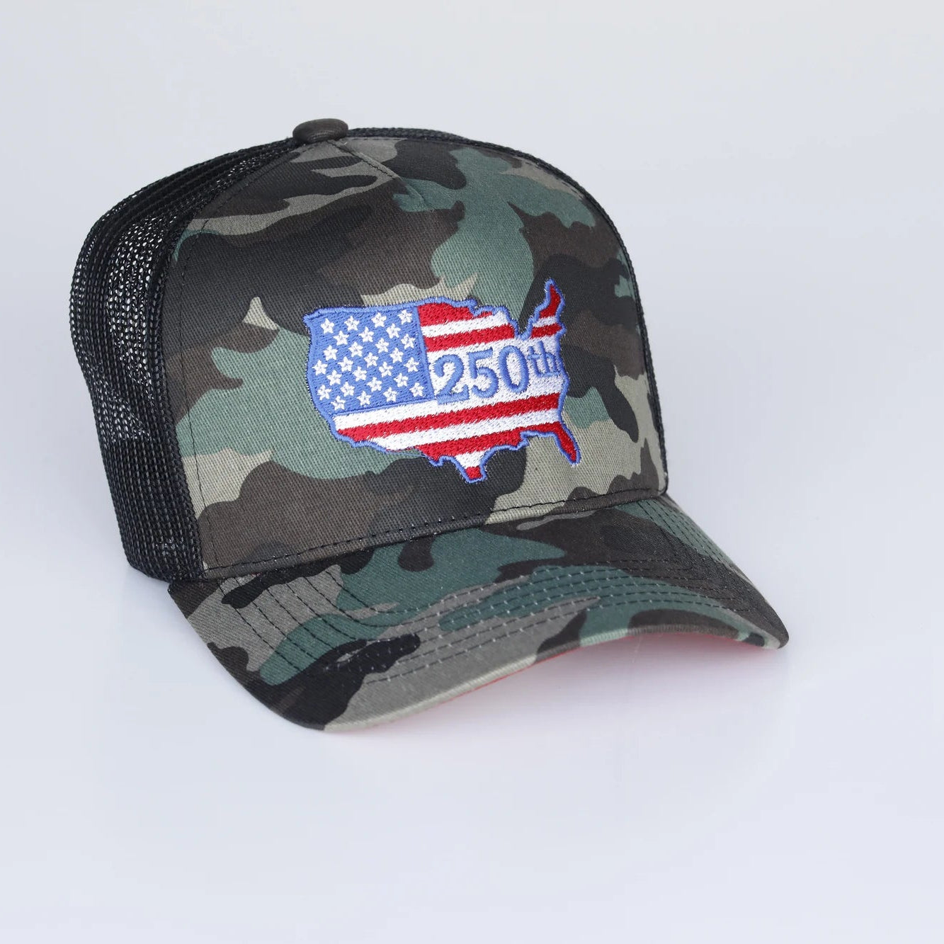 Camouflage trucker hat with American flag design on a white background