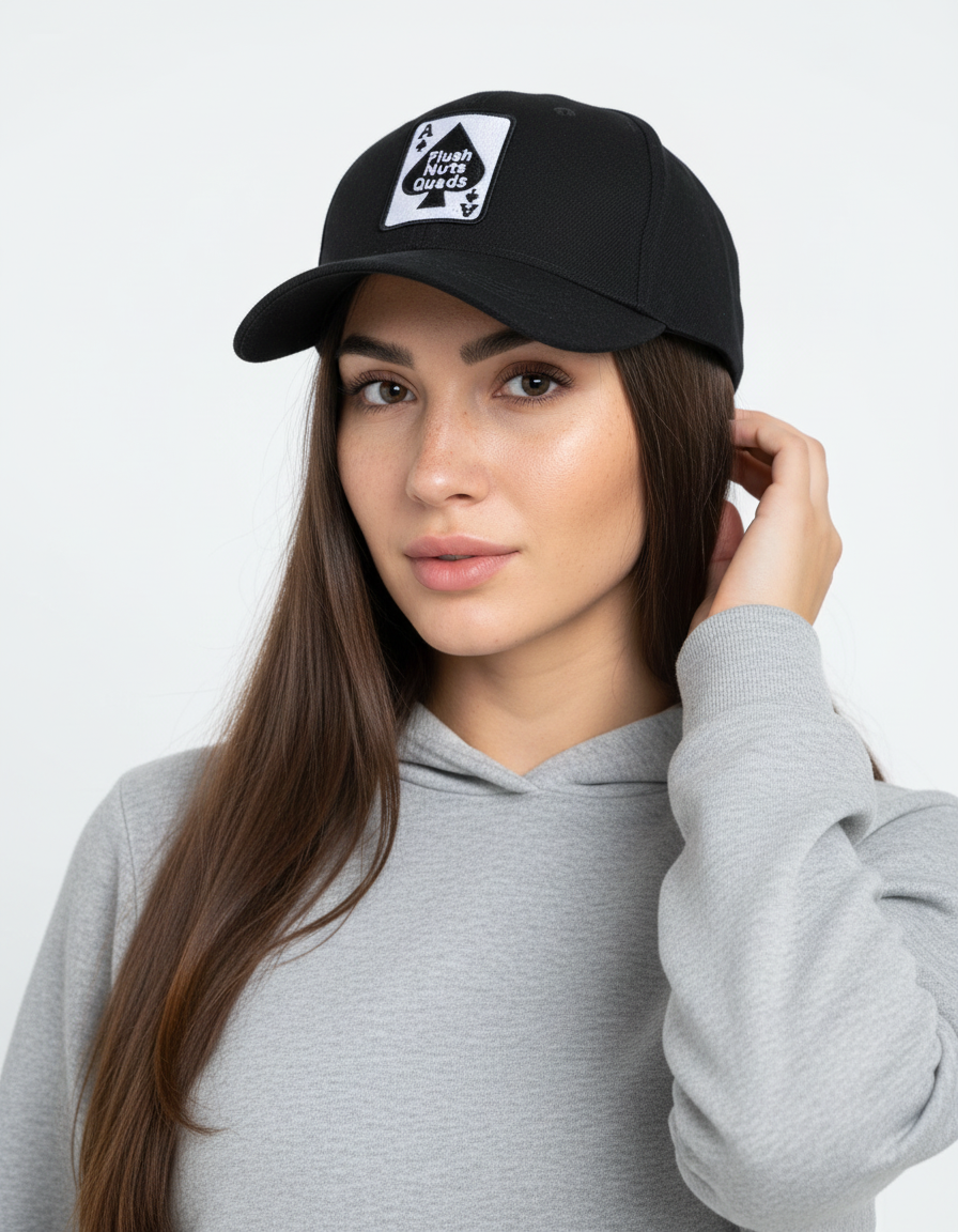 Woman wearing a black cap with a logo and a gray hoodie on a white background