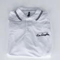 White polo shirt with 'Los Angeles' embroidery on a light gray background