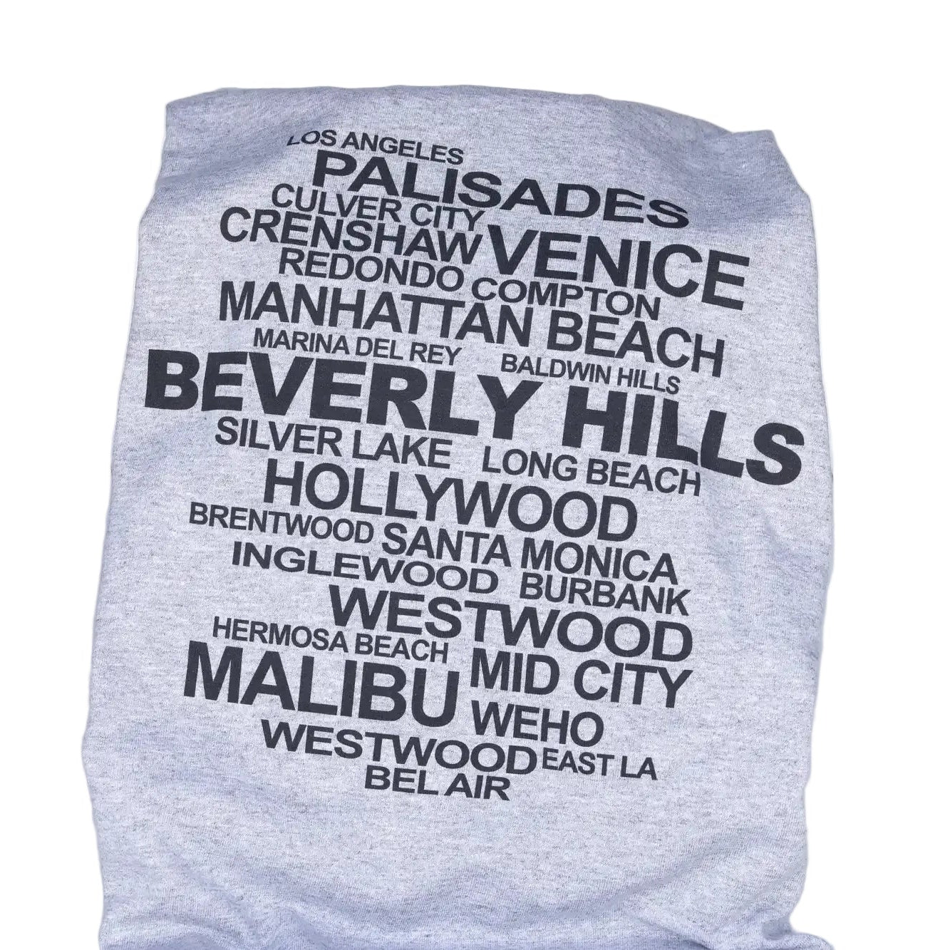 Gray t-shirt with black text listing Los Angeles neighborhoods on a white background